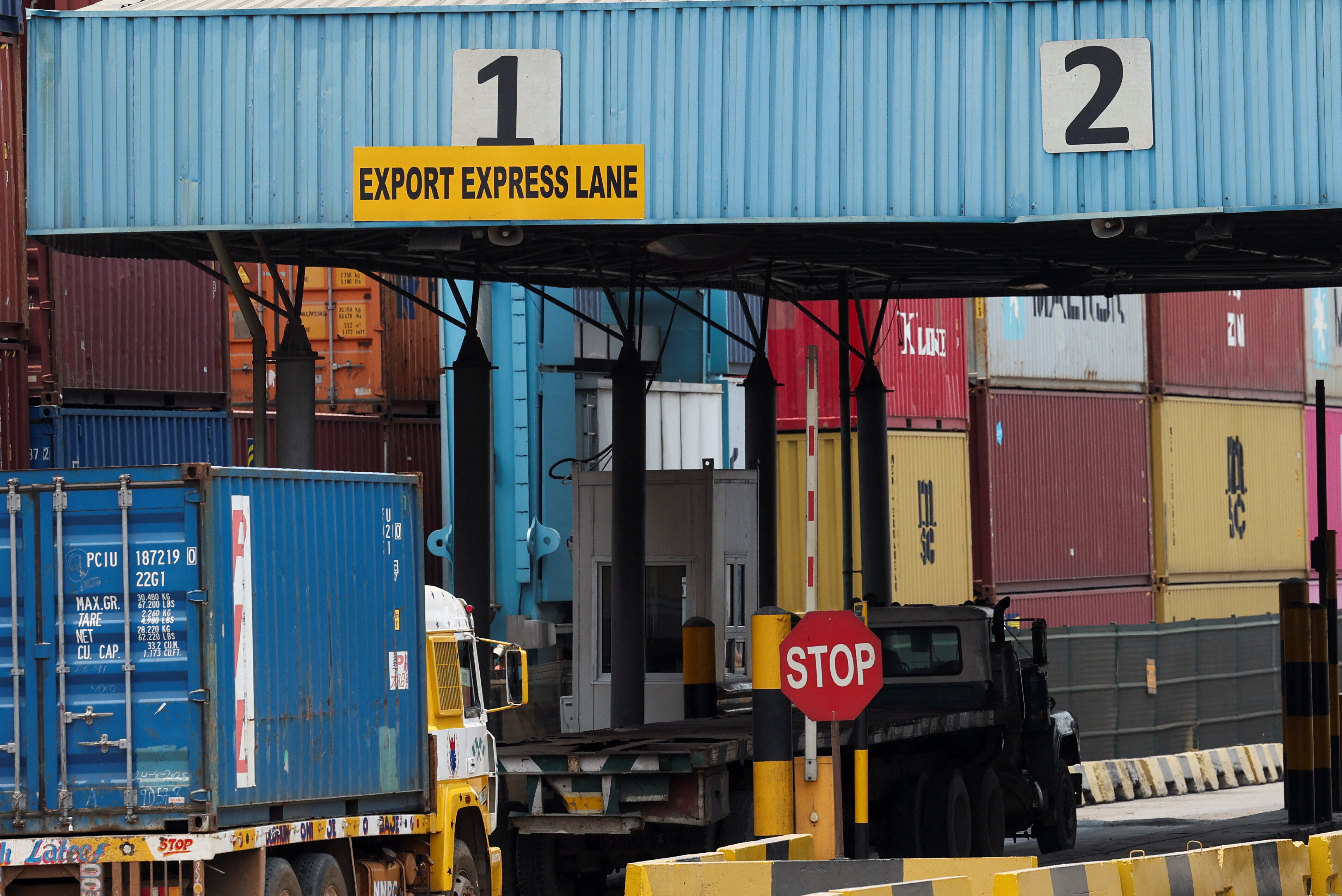 A truck transports a shipping container from the A.P. Moller Terminals to the export section of Nigeria's largest container terminal, located within the Nigerian Ports Authority dockyard in Apapa, in Lagos, Nigeria, August 25, 2025. Nigeria heavily relies on imported used vehicles from the U.S., with American exports accounting for over half used cars in the country. U.S. President Donald Trump's tariffs are anticipated to increase the cost of these imports. REUTERS/Sodiq Adelakun