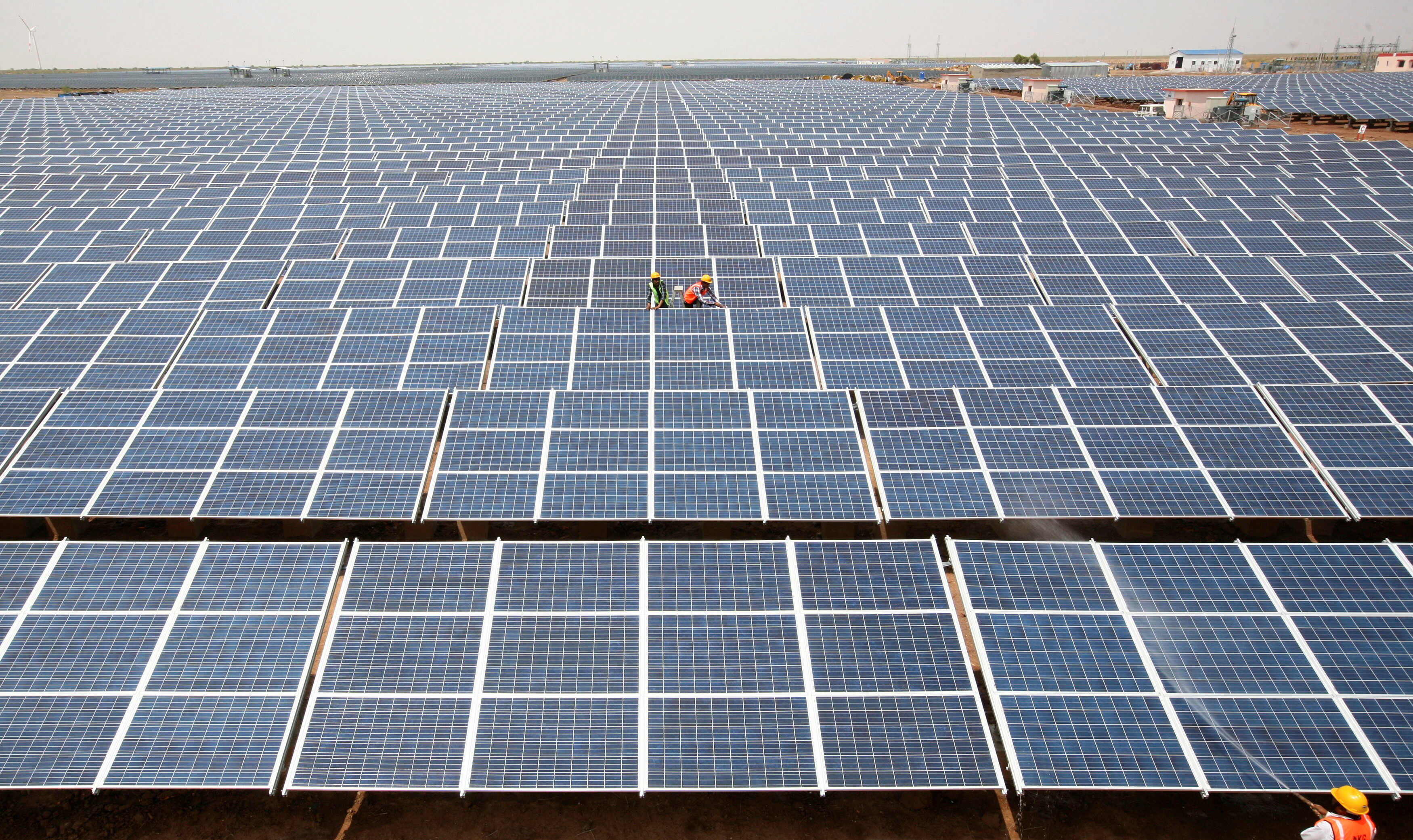 Energy transition: Workers install photovoltaic solar panels