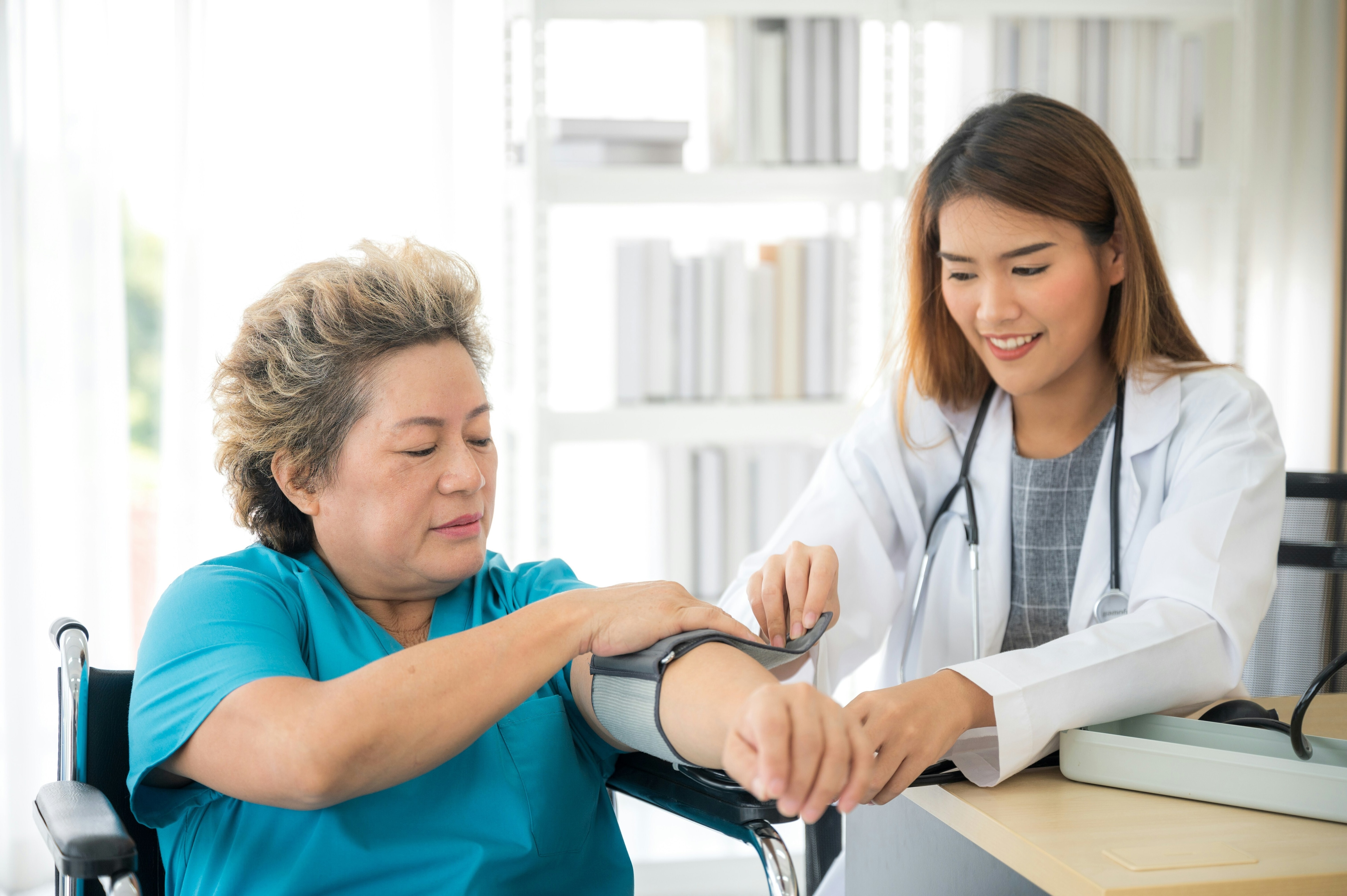 A doctor and a patient a data transforms health systems.