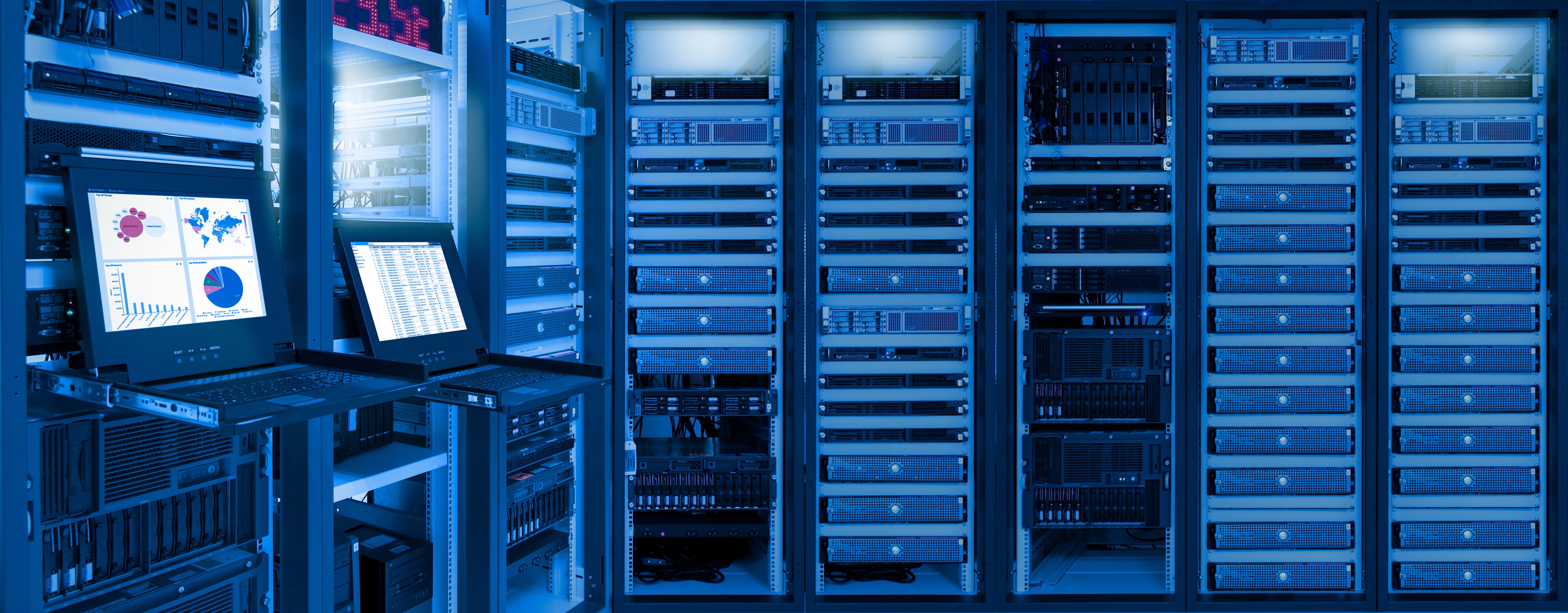 Monitor showing information, network traffic and status of devices in data centre room; AI infrastructure