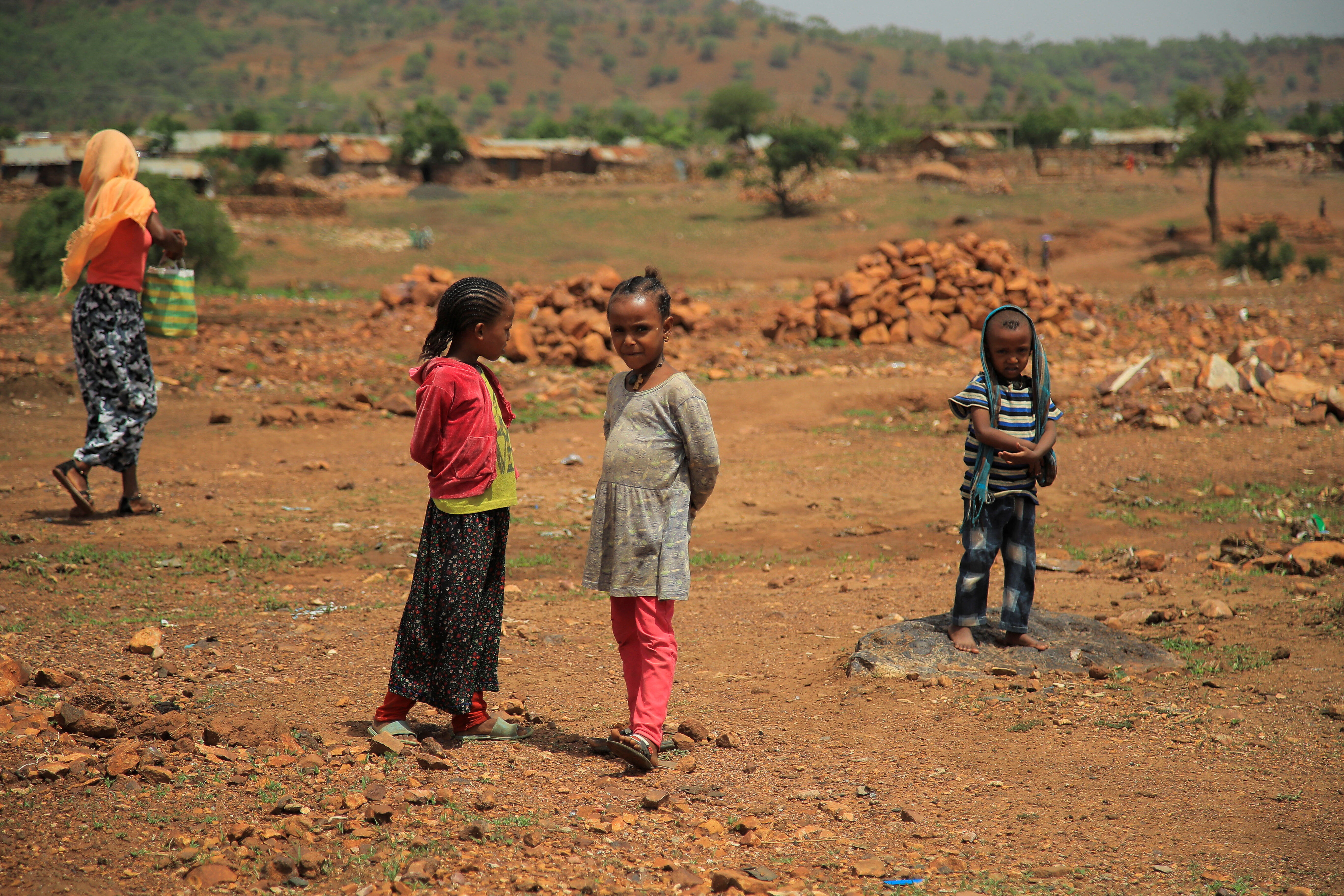 FILE PHOTO: Children stand outside Adi Harush Eritrean refugee camp in Mai Tsberi town in Tigray Region of Ethiopia, June 26, 2021. supply chains REUTERS/Tiksa Negeri/File Photo