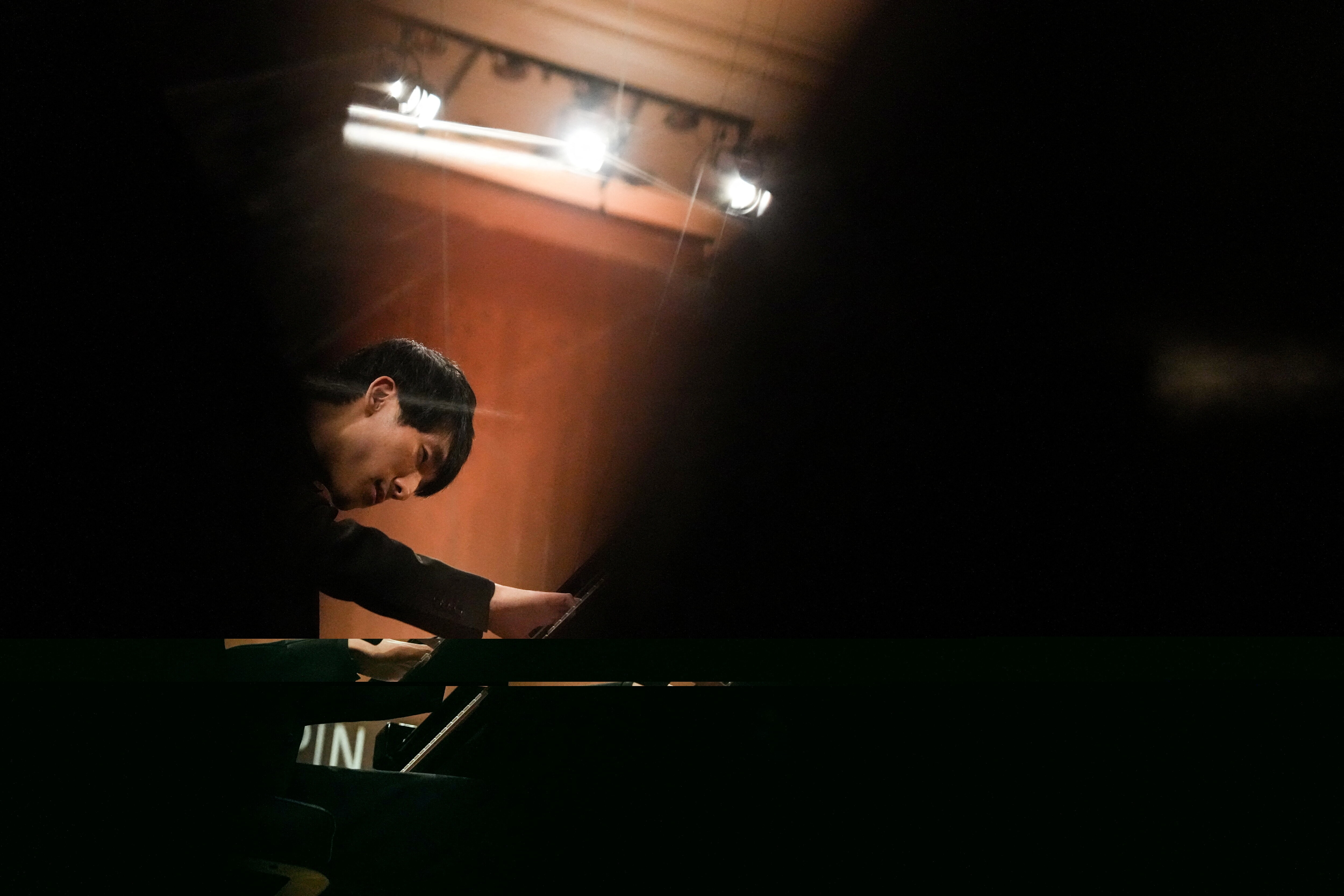 Eric Lu from the U.S. plays piano during the 19th International Fryderyk Chopin Piano Competition, in the concert hall of the National Philharmonic, in Warsaw, Poland, October 18, 2025. REUTERS/Aleksandra Szmigiel