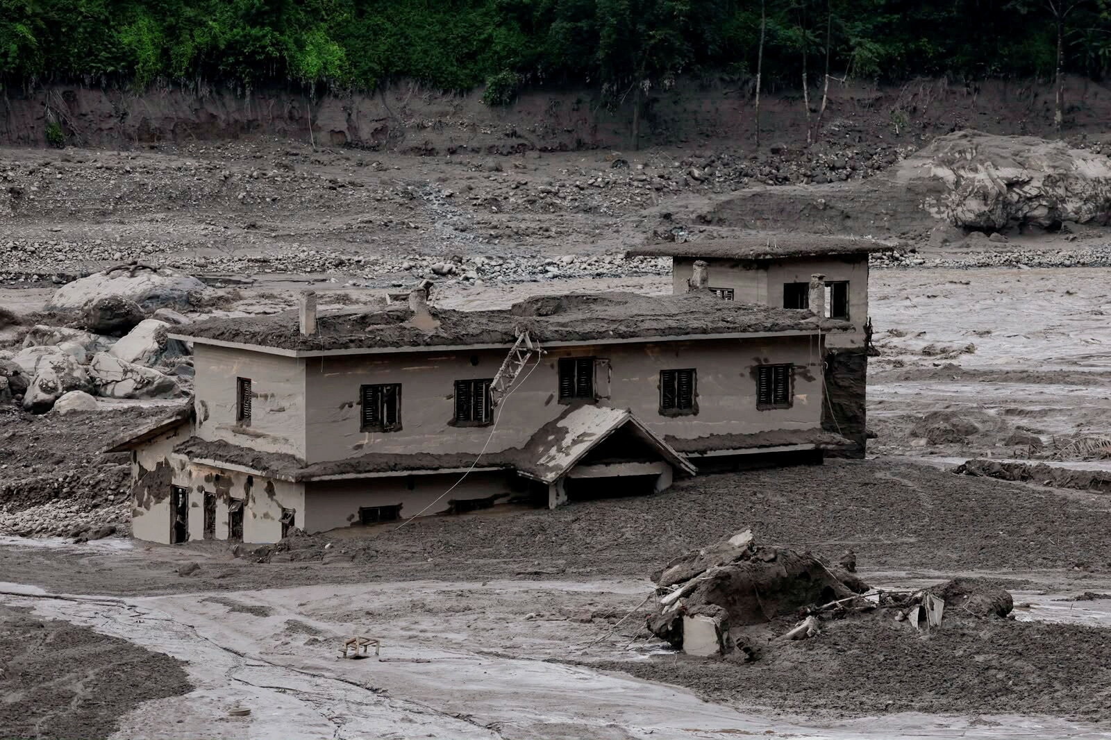 Mud covers a property following a flash flood at Trishuli in Nuwakot district, Nepal, 26 August, 2026. 