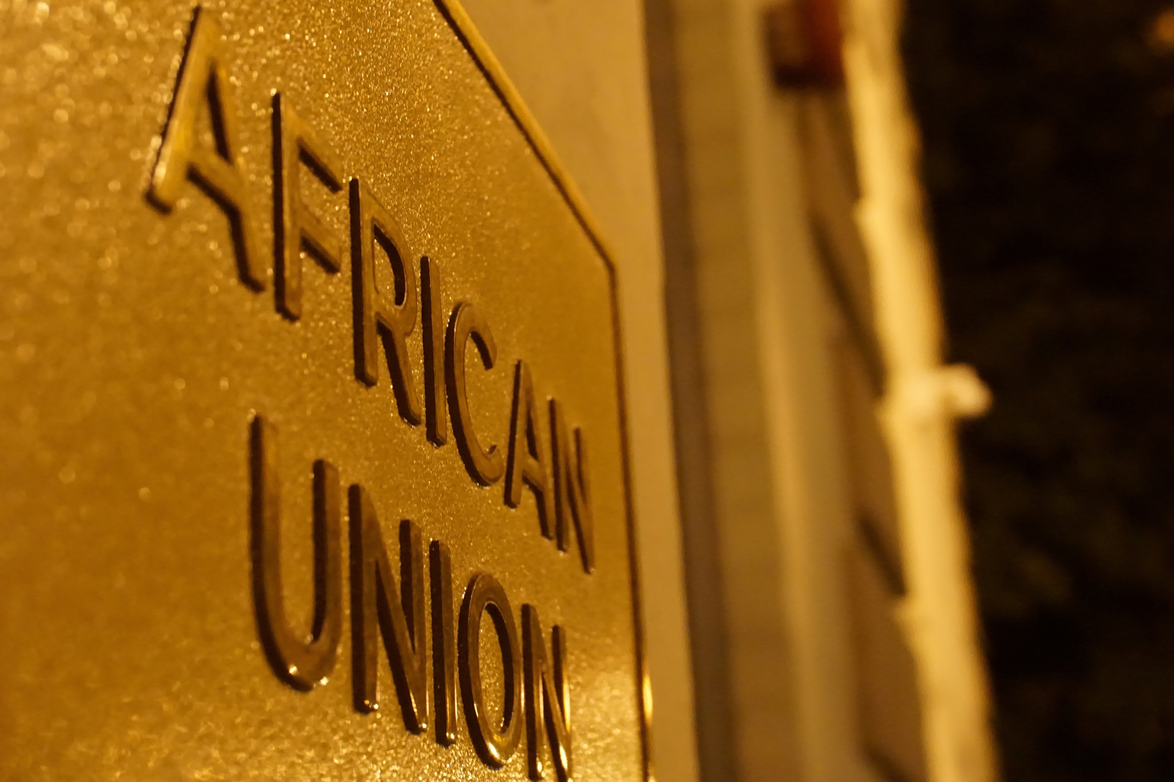 A signage at an entrance to the African Union (AU) Mission is pictured in Washington, D.C., U.S. December 15, 2020. Picture taken with a long exposure.  REUTERS/Raphael Satter