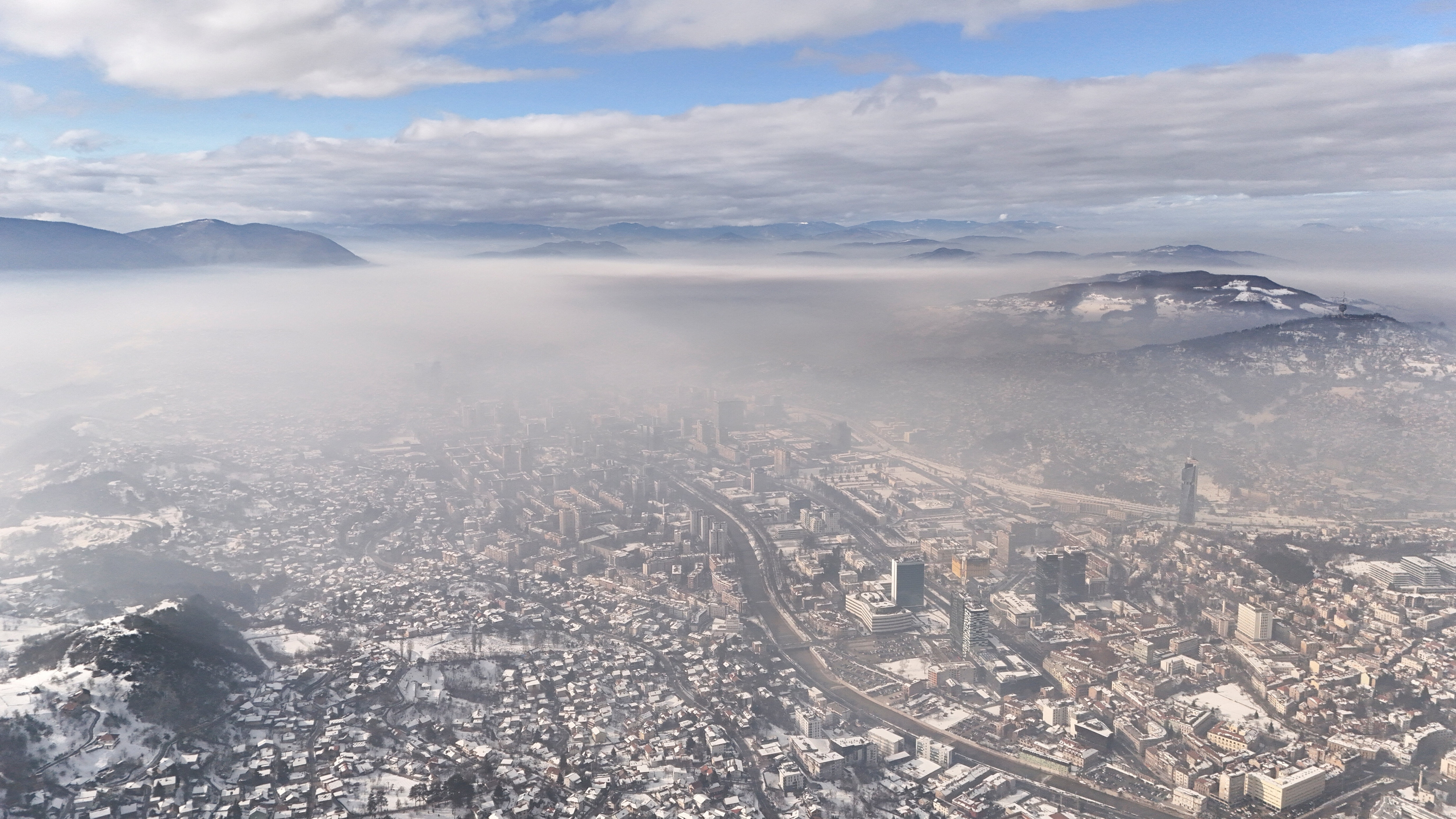 A drone view shows the Bosnian capital of Sarajevo covered with smog, in Sarajevo, Bosnia and Herzegovina.