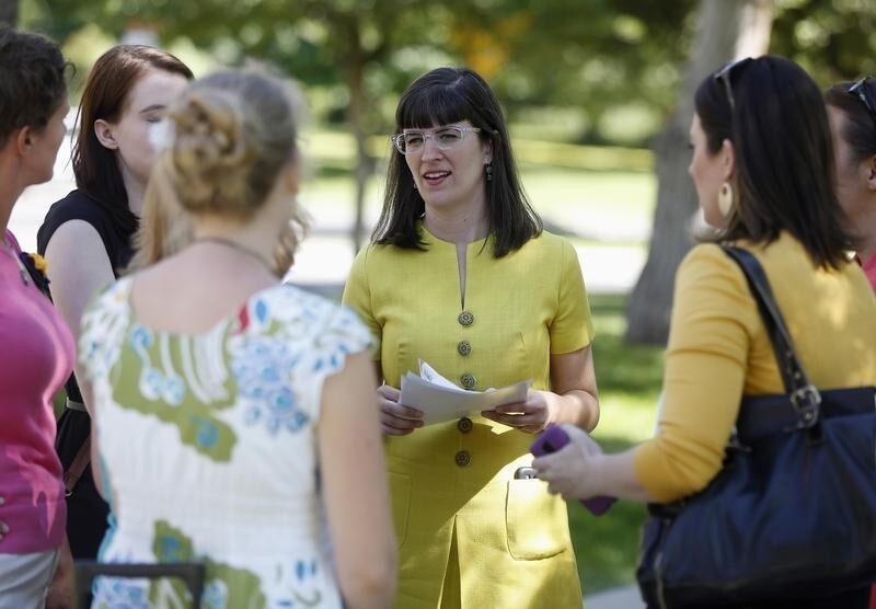 Kate Kelly of Ordain Women talks to supporters before a vigil as members of the leadership of The Church of Jesus Christ of Latter-day Saints consider her excommunication from the church in Salt Lake City, Utah