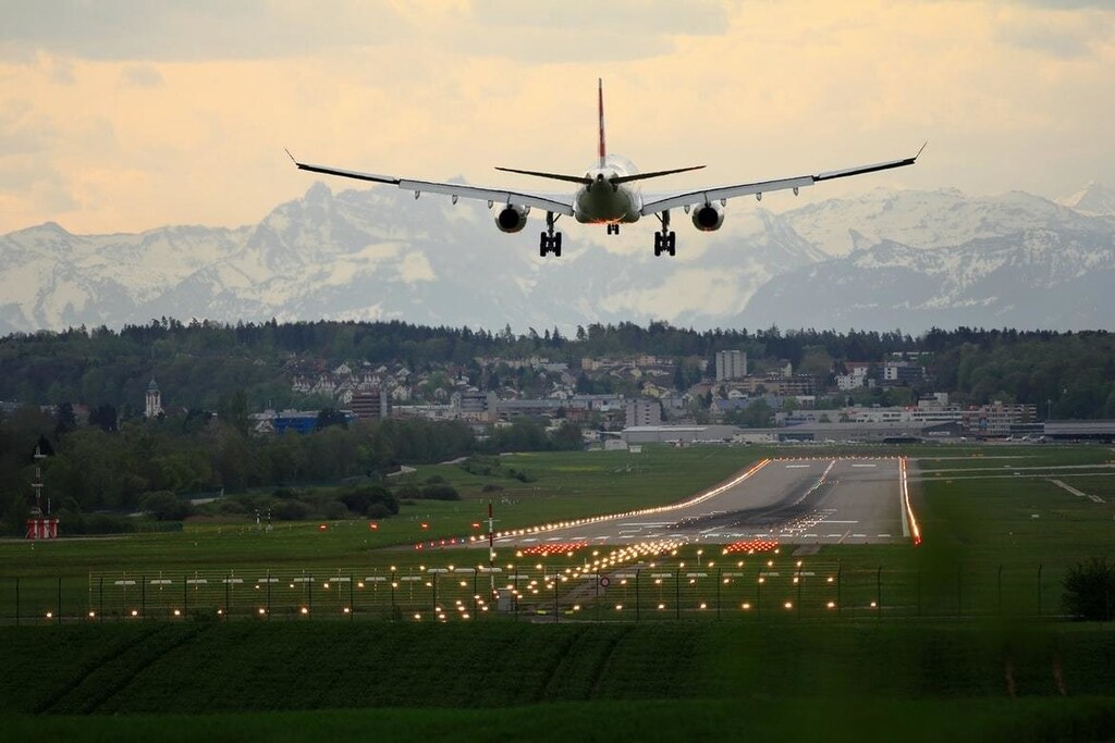 A plane landing at an airport.