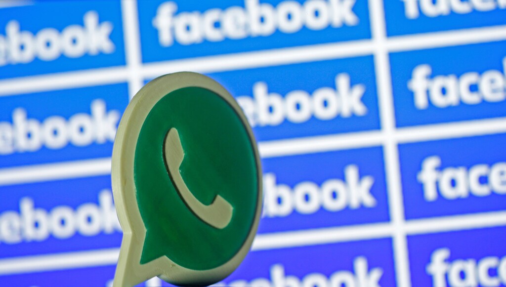 A 3D printed Whatsapp logo is seen in front of a displayed Facebook logo in this illustration taken April 28, 2016. REUTERS/Dado Ruvic/Illustration - RTX2C08X