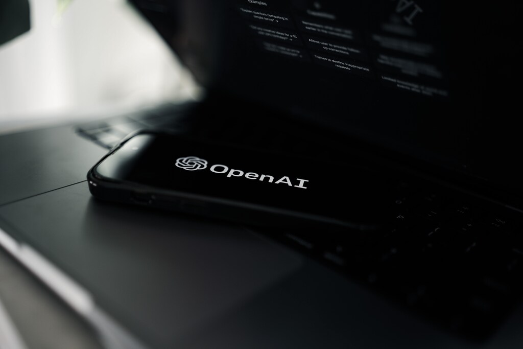 Mobile phone with OpenAI logo on screen