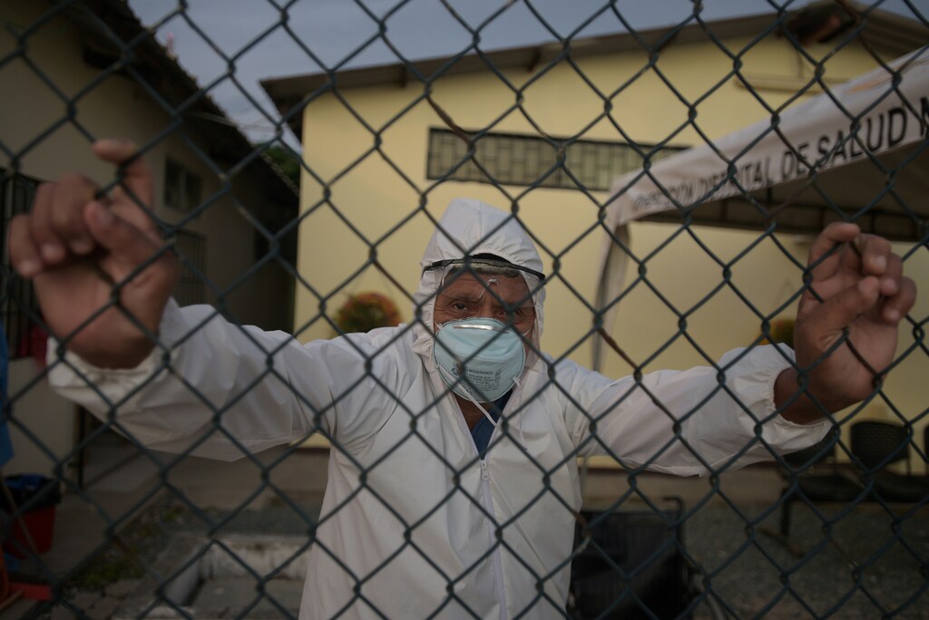 Doctor Bolivar Jalca, who is treating patients experiencing symptoms consistent with COVID-19, poses for a photograph outside Manglaralto Hospital, during the coronavirus disease (COVID-19) outbreak, in Manglaralto, Ecuador, May 2, 2020. REUTERS/Vicente Gaibor del Pino SEARCH "RURAL ECUADOR COVID-19" FOR THIS STORY. SEARCH "WIDER IMAGE" FOR ALL STORIES. - RC2CSG9MC13O