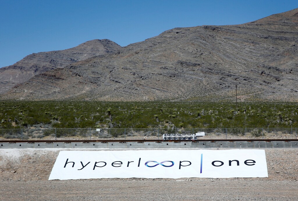 A sled (C) moves down a test track during a propulsion open-air test of high speed transportation technology at Hyperloop One in North Las Vegas, Nevada, U.S., May 11, 2016. REUTERS/Steve Marcus - RTX2DVYM