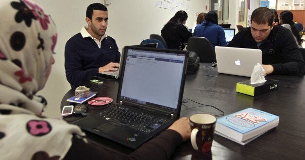 Young entrepreneurs work at the Amman-based Oasis 500, a seed investment firm which finances start-up firms in the region's information technology sector, November 2, 2011. Across the Middle East and North Africa, the Arab Spring uprisings have hurt many businessmen. Economies have slowed sharply as political uncertainty deters investment, new governments focus on trying to restore social stability instead of reforming economic policy, and labour unrest disrupts production and drives up costs. Oasis 500's Executive Chairman Usama Fayyad said governments had become more careful about appearing even-handed towards companies, even in countries that have been relatively untouched by the Arab Spring. In the long term, though, a cleaner, fairer business environment could, even more than other economic reforms such as deregulation and fiscal policy changes, help to solve one of the Arab world's biggest problems: job creation. A more level playing field could spur the growth of similar small and medium-sized firms. Picture taken November 2, 2011. To match Mideast Money ARAB-BUSINESS/SPRING REUTERS/Muhammad Hamed (JORDAN - Tags: BUSI