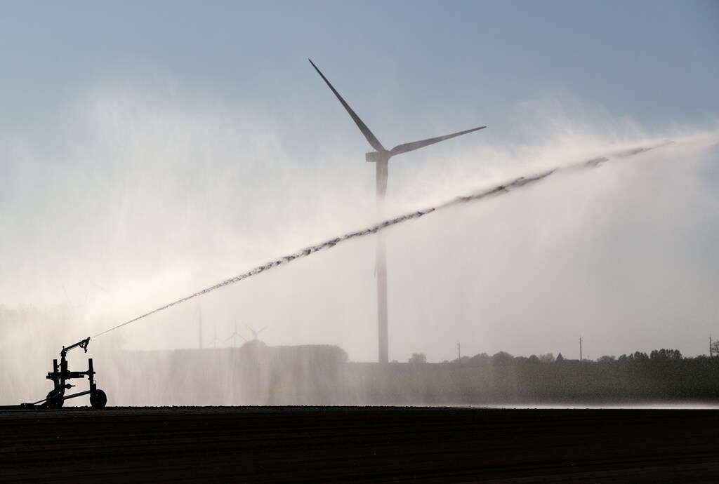 Wind turbines are pictured in a field as the country battles against the coronavirus disease (COVID-19) outbreak, near Waremme, Belgium April 22, 2020. water