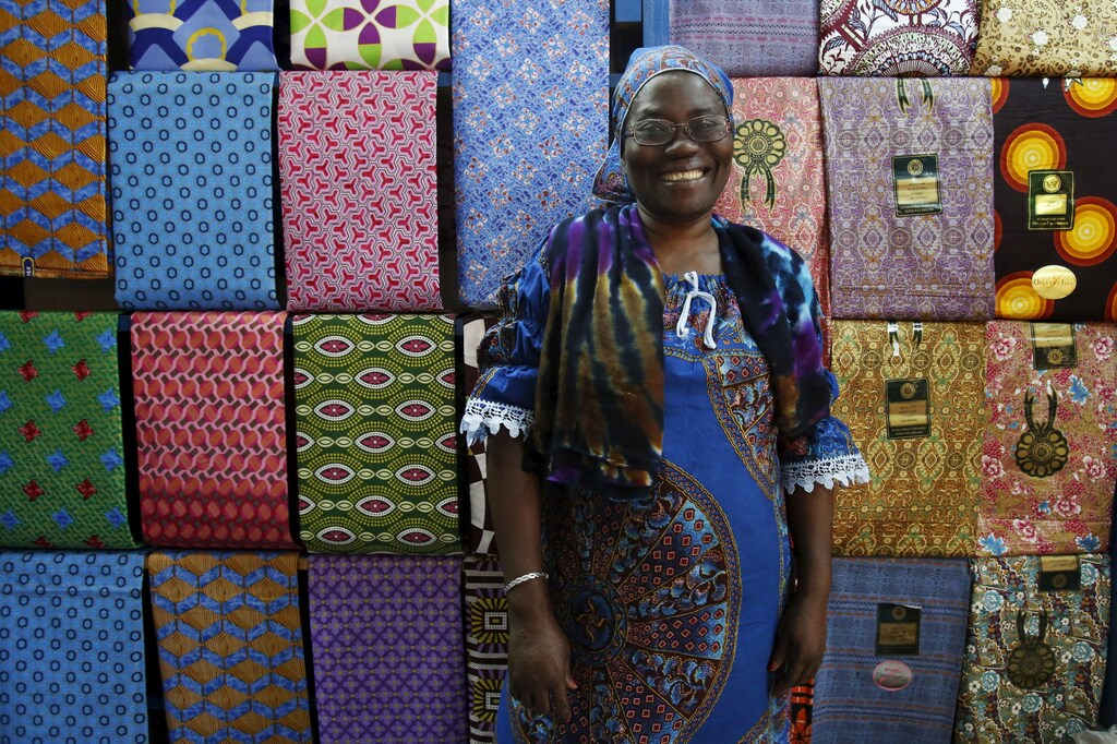 Fofanan Man, a 59-year-old businesswoman, poses for a photograph in front of textiles in her shop in Bouake, Ivory Coast, February 10, 2016. Women have long played a dominant role in agriculture in Ivory Coast and in the sprawling markets where most Ivorians purchase their daily necessities. Now some are breaking through into the most important positions in government, administration and business - positions long held by males in this traditional society. In 2012, Niale Kaba became finance minister, the first woman to hold the post in more than half a century as an independent nation. Ivorian women today work in a range of jobs Ã¢â¬â from gas-station attendant to plastic recycler and lawyer. International Women's Day is marked on March 8. REUTERS/Thierry Gouegnon SEARCH "THE WIDER IMAGE" FOR ALL STORIES - GF10000336765