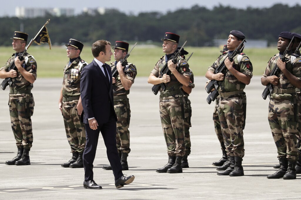 French President Emmanuel Macron reviews troops upon his arrival at Remy de Haenen airport on the Caribbean island of Saint Barthelemy, France September 28, 2018. Thomas Samson/Pool via REUTERS - RC1573265B20