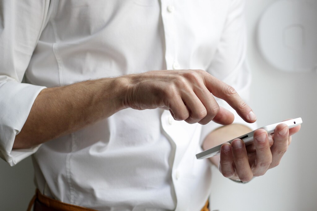 this man is using his smartphone to look up a question