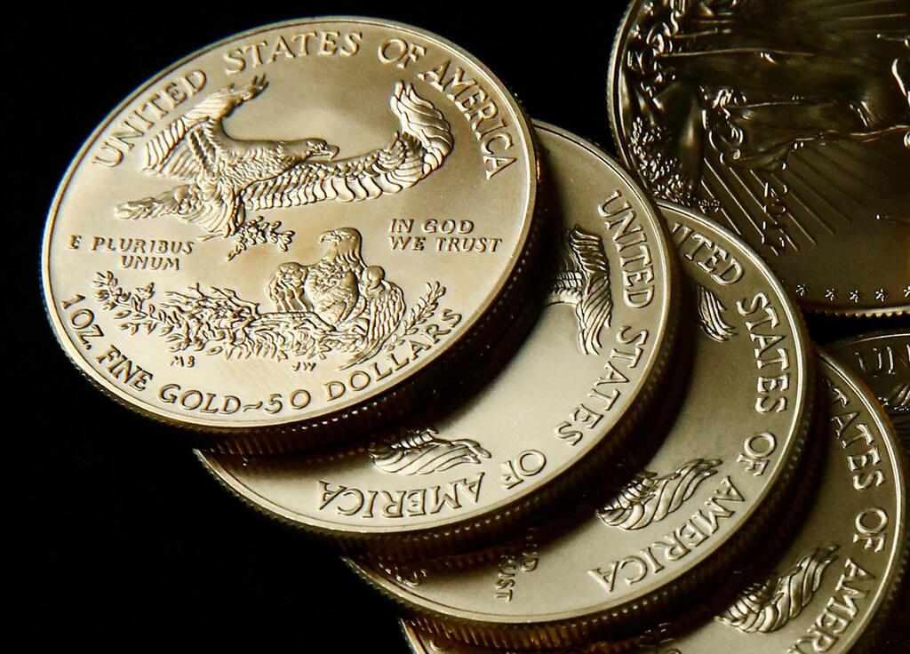 Gold U.S. dollar bullion coins are seen in this photo illustration taken in Moscow, Russia August 4, 2017. Picture taken August 4, 2017. REUTERS/Maxim Shemetov/Illustration - RC1B47C63700