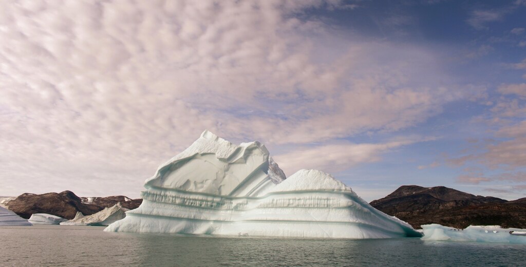 An iceberg floats in a fjord near the town of Kulusuk in eastern Greenland August 2, 2009.