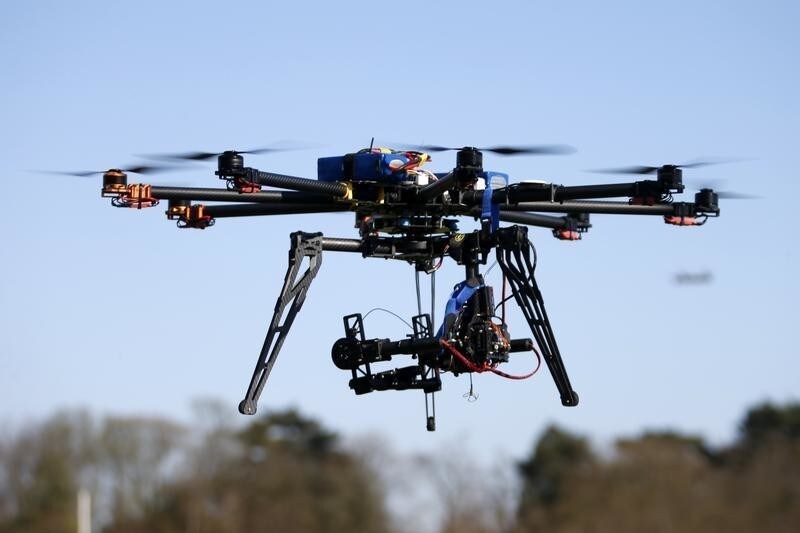 An octocopter (a drone with eight rotors) flies during the 4th Intergalactic Meeting of Phantom's Pilots (MIPP) in an open secure area in the Bois de Boulogne, western Paris, March 16, 2014. Drone operators in France are required to complete a training course to fly an unmanned aerial vehicle and also receive written approval for flights in urban areas. Picture taken March 16, 2014.