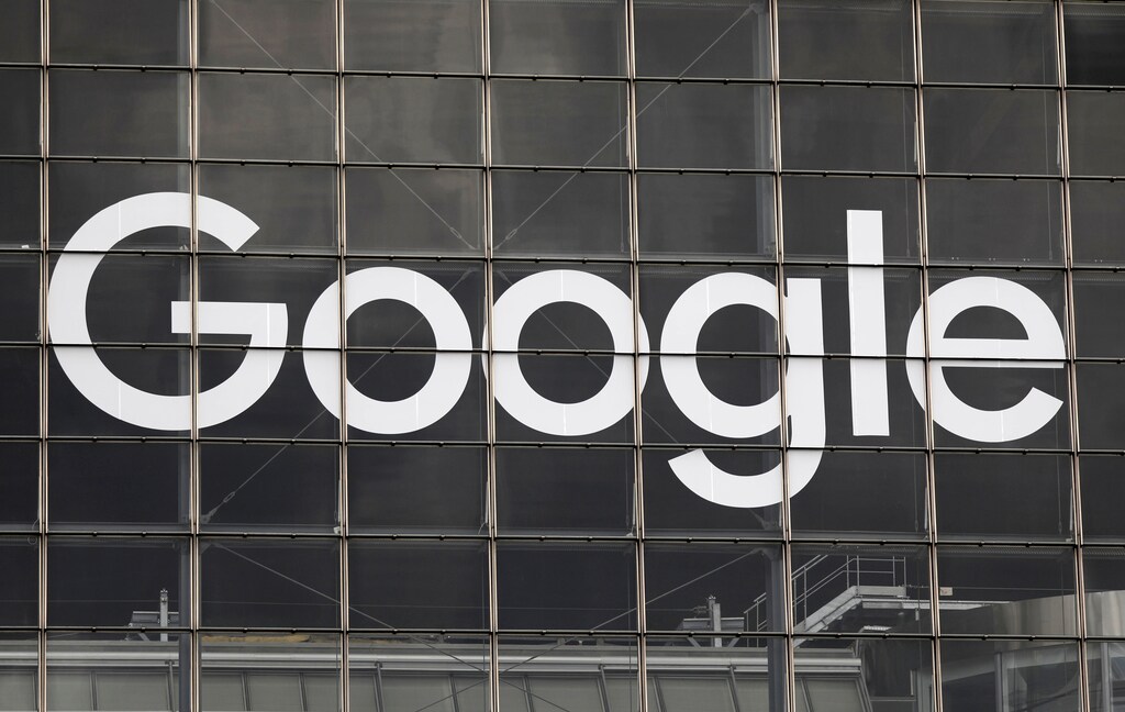 The logo of Google is seen on a building at la Defense business and financial district in Courbevoie near Paris, France, September 1, 2020. REUTERS/Charles Platiau - RC2PPI9ZJ90P