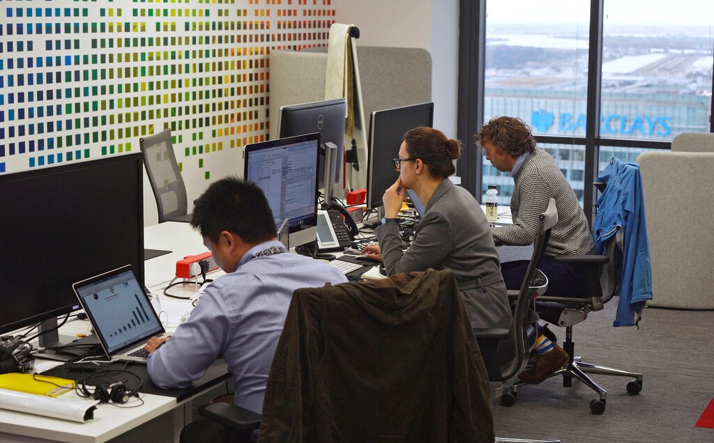 UBS employees work in the UBS "fintech lab" at Canary Wharf in London, Britain, October 19, 2016. REUTERS/Hannah McKay - RTX2PJII