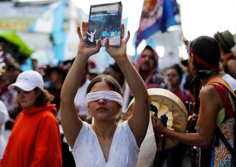 Demonstrators take part in a march to protest against the decision of Guatemala President Jimmy Morales to end the mandate of the U.N.-backed anti-graft commission (CICIG), in Guatemala City, Guatemala, January 12, 2019. REUTERS/ Luis Echeverria - RC154FBF97E0