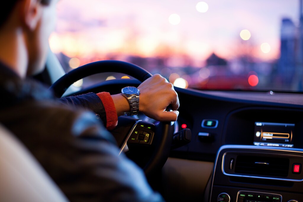 a person driving their car on their commute to work