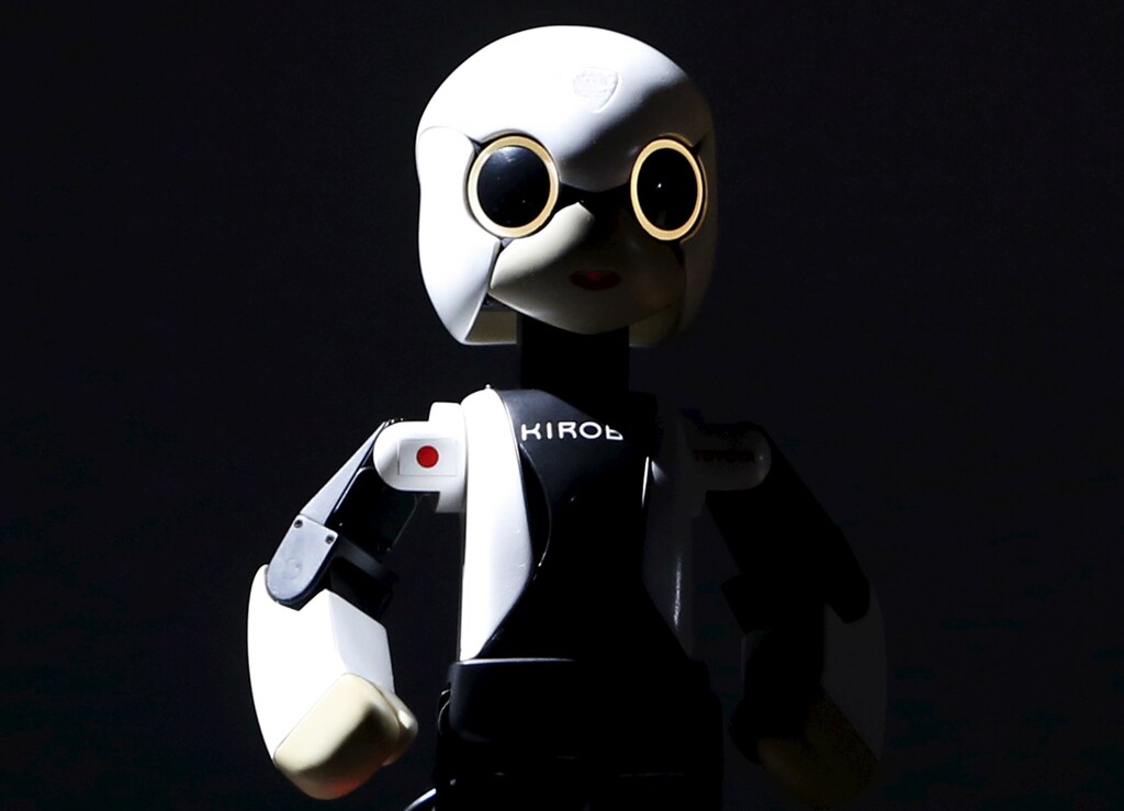 Humanoid communication robot Kirobo appears on stage during a return debriefing session from the International Space Station to Japan, in Tokyo March 27, 2015. Kirobo has been awarded two Guinness World Records which are, "the first companion robot in space" and "the highest altitude for a robot to have a conversation". REUTERS/Yuya Shino - RTR4V39V