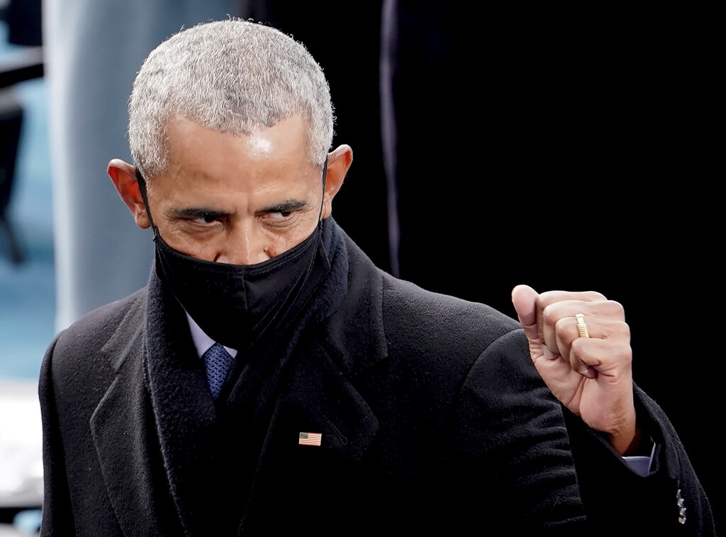 Former U.S. President Barack Obama acknowledges someone during the 59th Presidential Inauguration for President-elect Joe Biden and Vice President-elect Kamala Harris, in Washington, U.S., January 20, 2021. Picture taken January 20, 2021. Greg Nash/Pool via REUTERS - RC2HCL9EQRJY