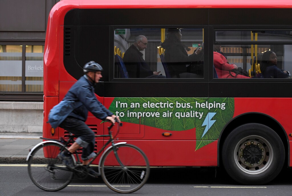 air pollution london uk europe Sadiq Khan environment renewable solar energy change transition friendly environment carbon footprint carbon emissions reduction change natural climate change global warming air pollution clean energy power renewables plastic plastics Weather extreme storm hurricane typhoon flooding flood floods danger rain wind windy rainy flash floods Agriculture pollen insects bugs bees honeybees bumblebees farming farms crops crop stable A cyclist rides past an electric public bus on the day that Mayor of London Sadiq Khan outlined plans to place a levy on the most polluting vehicles in London, Britain, April 4, 2017. REUTERS/Toby Melville - RC1AE902D6B0