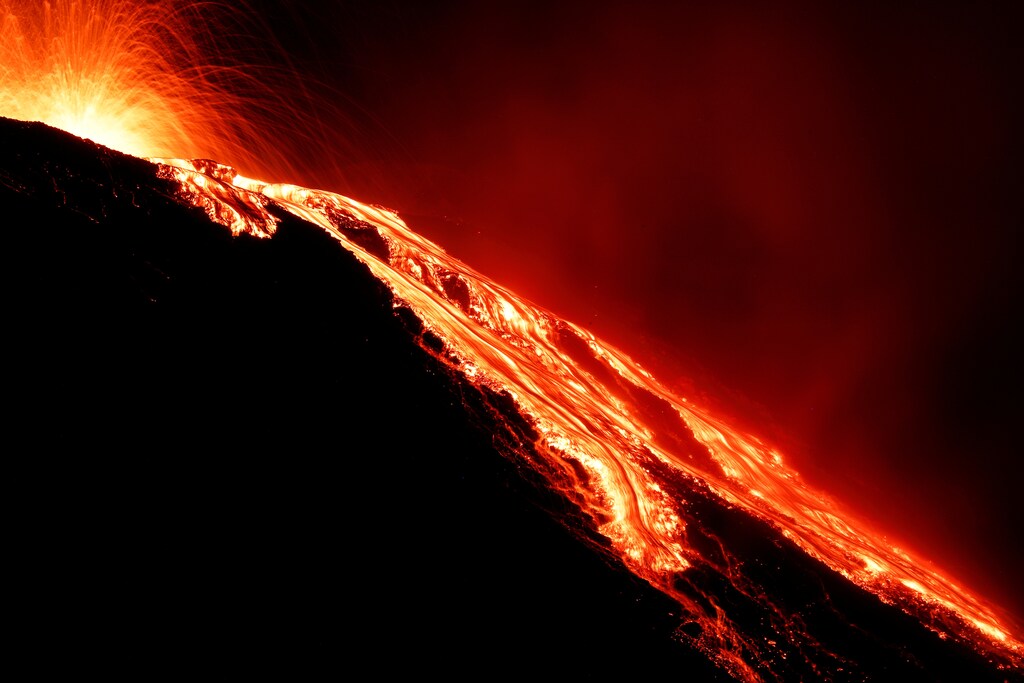 Lava flows from the Stromboli volcano a day after an eruption unleashed a plume of smoke on the Italian island of Stromboli, Italy, August 30, 2019. REUTERS/Antonio Parrinello TPX IMAGES OF THE DAY - RC16FE6A5D20