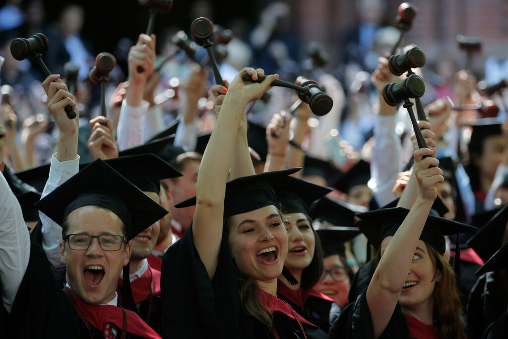 Graduating Law School students cheer as they receive their degrees during the 365th Commencement Exercises at Harvard University in Cambridge, Massachusetts, U.S. May 26, 2016. REUTERS/Brian Snyder - S1BETGHJWQAA