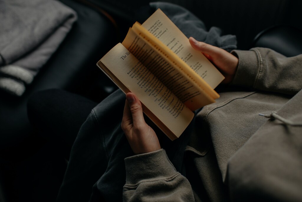 Person reading book.
