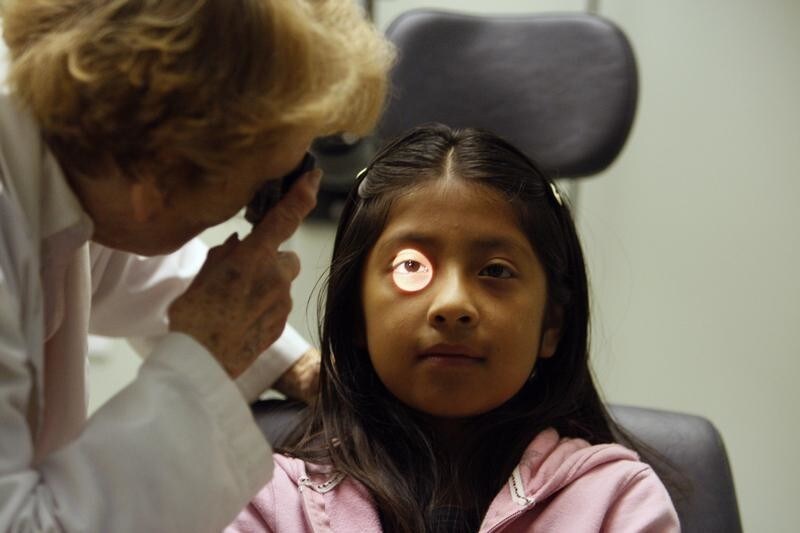 Uninsured patient Yulisa Mateo, 9, has an eye test at Venice Family Clinic in Venice, California, June 25, 2009. Some 47 million Americans are uninsured and have little access to the healthcare system. Insurance costs have doubled in under a decade, prompting businesses that provide much of the coverage to complain it threatens U.S. global competitiveness.