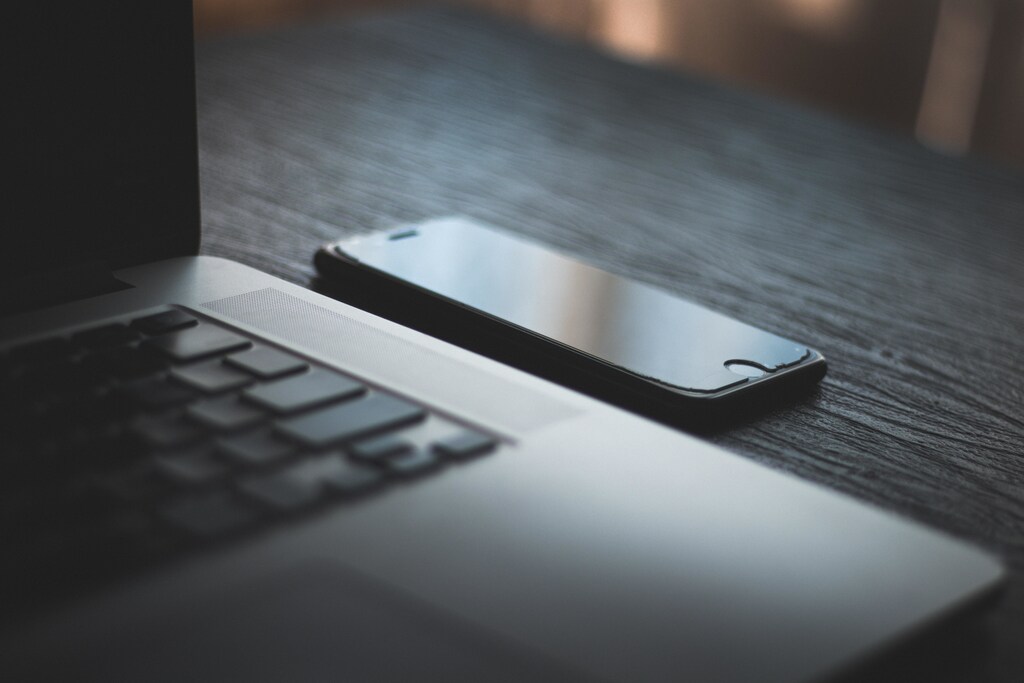 Laptop and phone with black screens