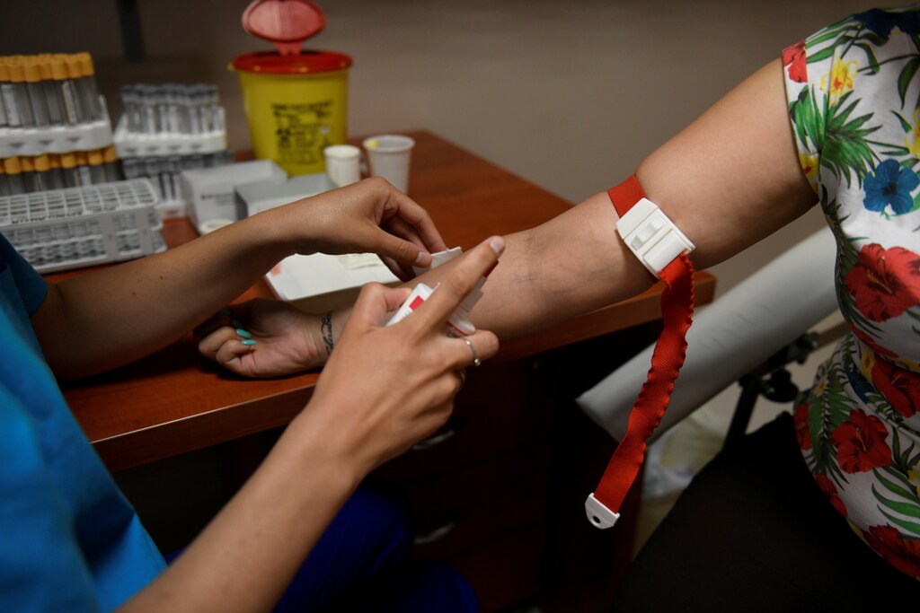 A medical worker draws blood at Robert Karoly Private Hospital in Budapest, Hungary, July 4, 2019. Picture taken July 4, 2019. REUTERS/Tamas Kaszas - RC118362E470