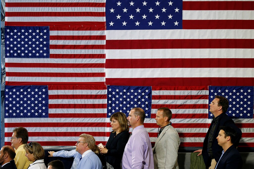 People listen as U.S. President Donald Trump speaks about tax reform in Harrisburg, Pennsylvania, U.S., October 11, 2017. REUTERS/Joshua Roberts TPX IMAGES OF THE DAY - RC128237A400