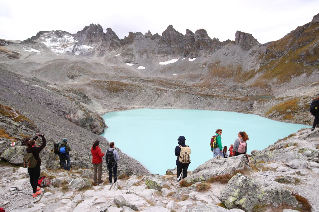 People look at the Pizol glacier as they take part in a mourning ceremony as awareness to climate change, Switzerland, September 22, 2019. REUTERS/Denis Balibouse - RC146B34AC50