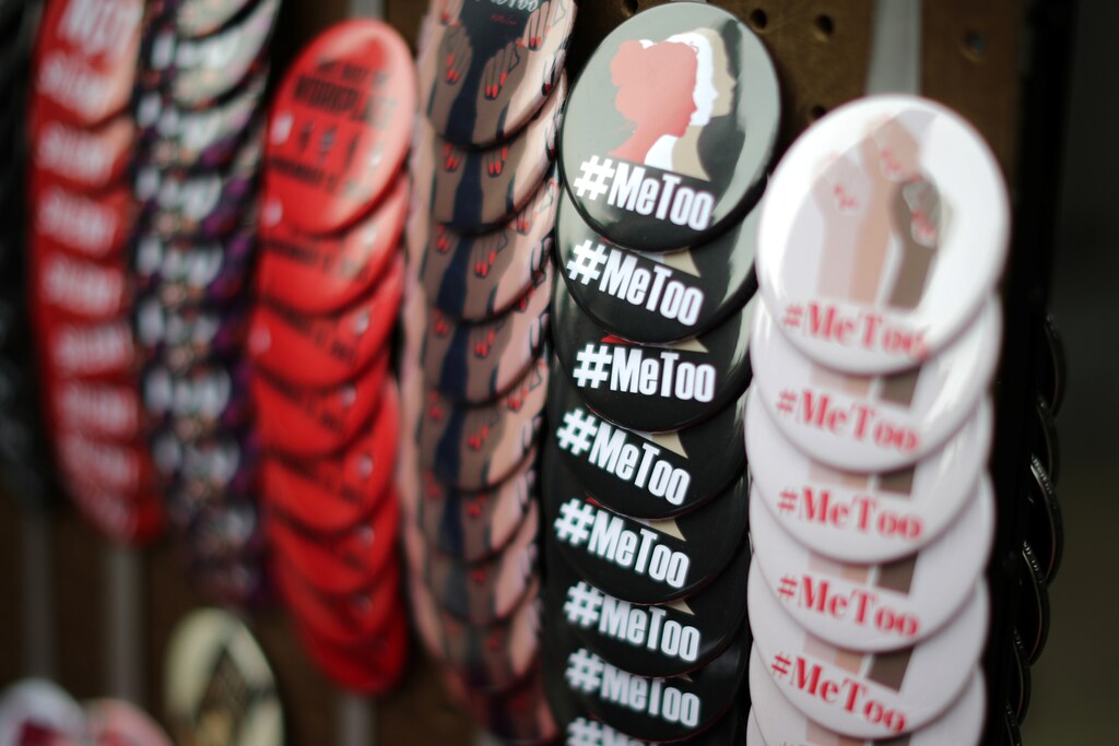 A vendor sells #MeToo badges a protest march for survivors of sexual assault and their supporters in Hollywood, Los Angeles, California U.S. November 12, 2017. REUTERS/Lucy Nicholson - RC18A2D7F850
