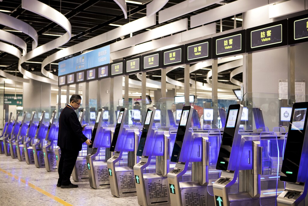 A man uses an automated immigration clearance machine for departing passengers in the Hong Kong Port Area at West Kowloon Station, which houses the terminal for the Guangzhou-Shenzhen-Hong Kong Express Rail Link (XRL), developed by MTR Corp., in Hong Kong, China, September 22, 2018. Giulia Marchi/Pool via REUTERS - RC1A9EB00A60