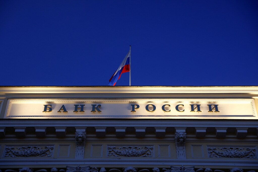 A Russian state flag flies over the Central Bank headquarters in Moscow, Russia.