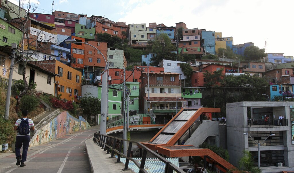 A man walks in the "Comuna 13" neighborhood in Medellin September 2, 2015.