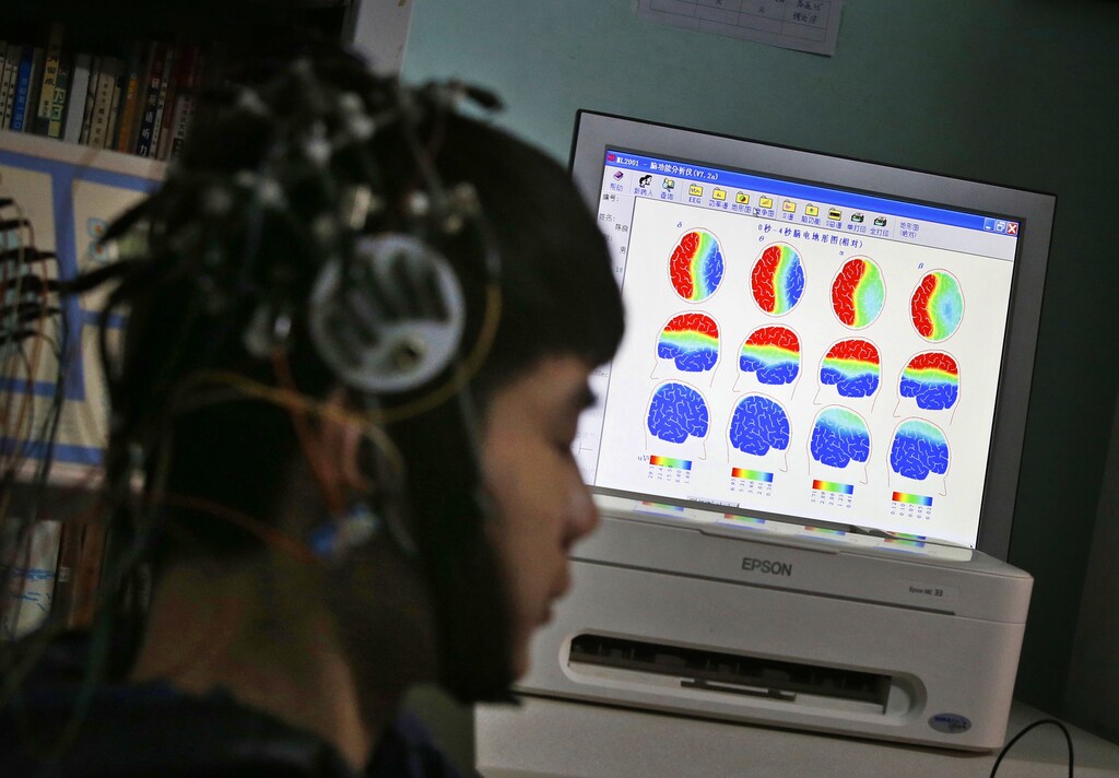 A boy who was addicted to the internet, has his brain scanned for research purposes at Daxing Internet Addiction Treatment Center in Beijing February 22, 2014. As growing numbers of young people in China immerse themselves in the cyber world, spending hours playing games online, worried parents are increasingly turning to boot camps to crush addiction. Military-style boot camps, designed to wean young people off their addiction to the internet, number as many as 250 in China alone. Picture taken February 22, 2014. REUTERS/Kim Kyung-Hoon (CHINA - Tags: SOCIETY)ATTENTION EDITORS - PICTURE 20 OF 33 FOR PACKAGE 'CURING CHINA'S INTERNET ADDICTS'TO FIND ALL IMAGES SEARCH 'INTERNET BOOT CAMP' - RTR3WL80