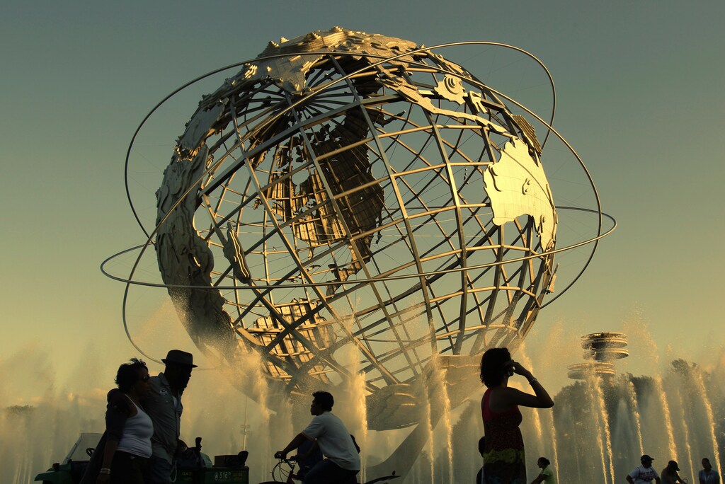 People walk past the fountain outside the Billie Jean King National Tennis Centre during the U.S. Open tennis tournament in New York, September 4, 2010.