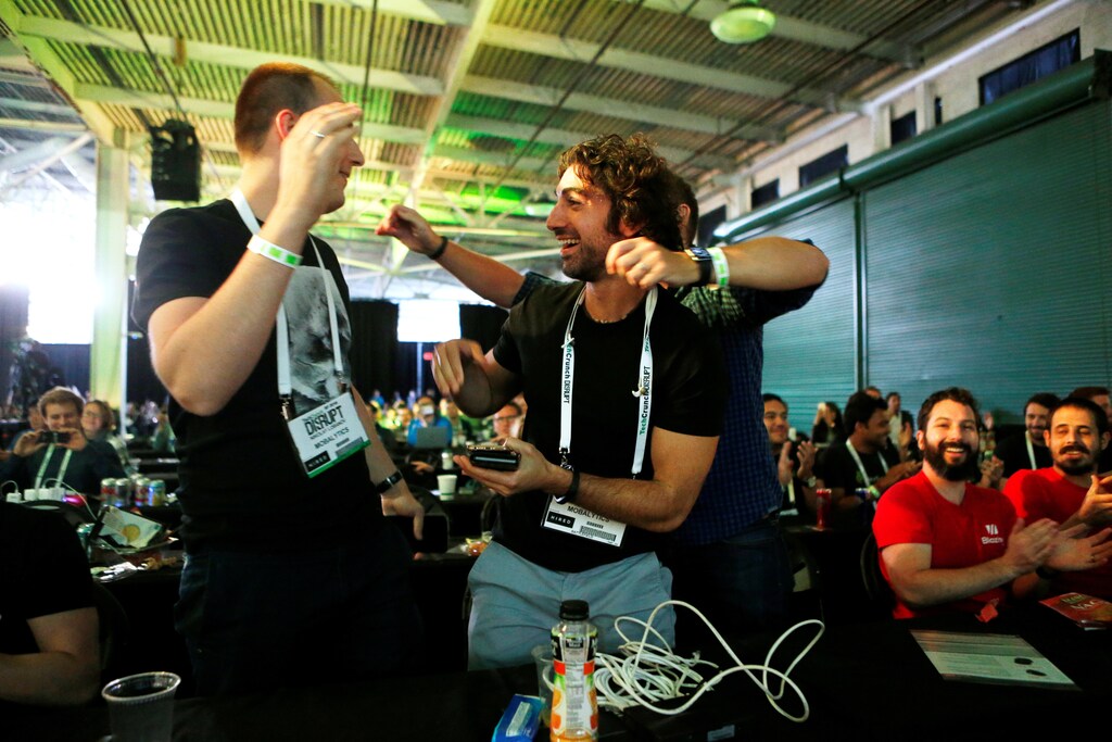 Amine Issa (2nd L), Nikolay Lobanov (L) and Bogdan Suchyk (R) of Mobalytics celebrate after winning the Startup Battlefield Finals of the 2016 TechCrunch Disrupt in San Francisco, California, U.S. September 14, 2016. REUTERS/Beck Diefenbach - RTSNSTY