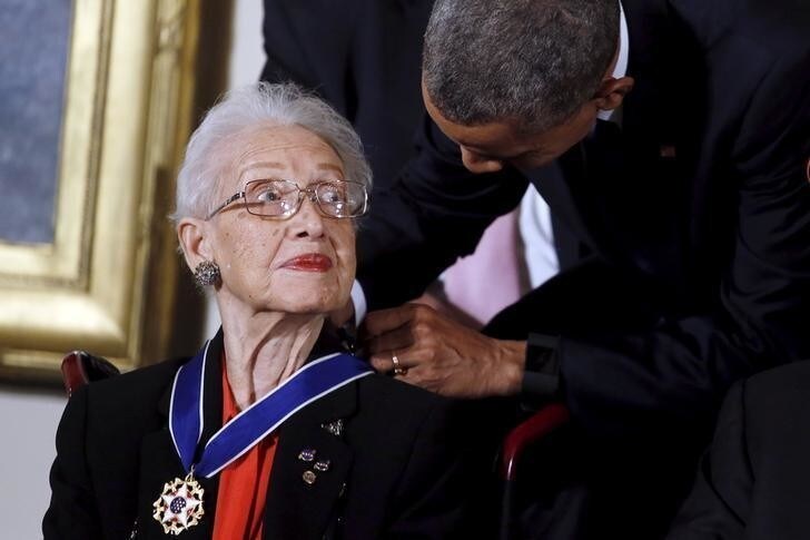 U.S. President Barack Obama presents the Presidential Medal of Freedom to NASA mathematician Katherine G. Johnson during an event in the East Room of the White House in Washington November 24, 2015. Johnson is a pioneer in American space history. REUTERS/Carlos Barria