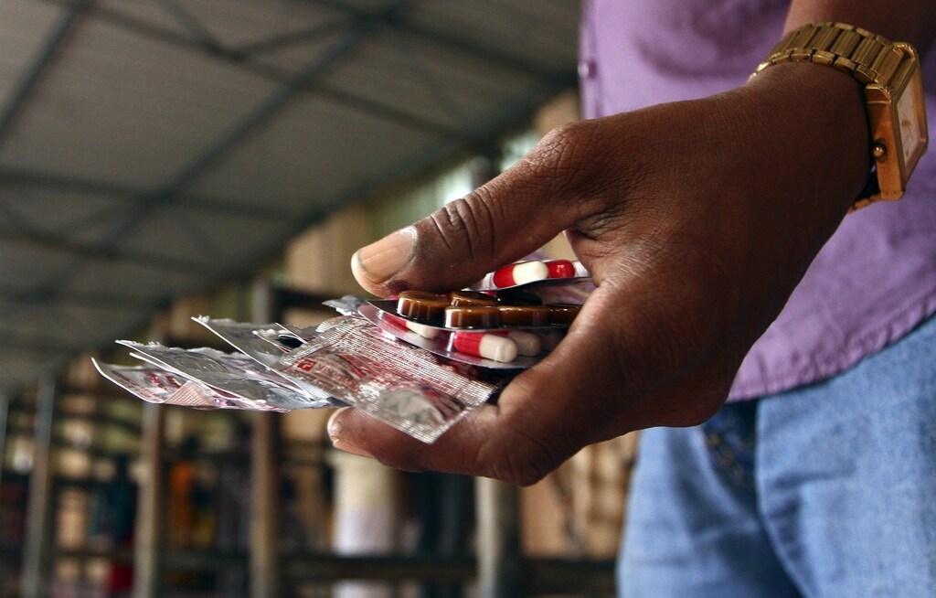 A patient holds free medicine provided by the government at Rajiv Gandhi Government General Hospital (RGGGH) in Chennai July 12, 2012. Chennai is the capital of Tamil Nadu, one of two Indian states offering free medicine for all. The state provides a glimpse of the hurdles India faces as it embarks on a programme to extend free drug coverage nationwide. Picture taken July 12, 2012. To match Analysis INDIA-DRUGS/ REUTERS/Babu (INDIA - Tags: HEALTH SOCIETY DRUGS) - RTR357HE