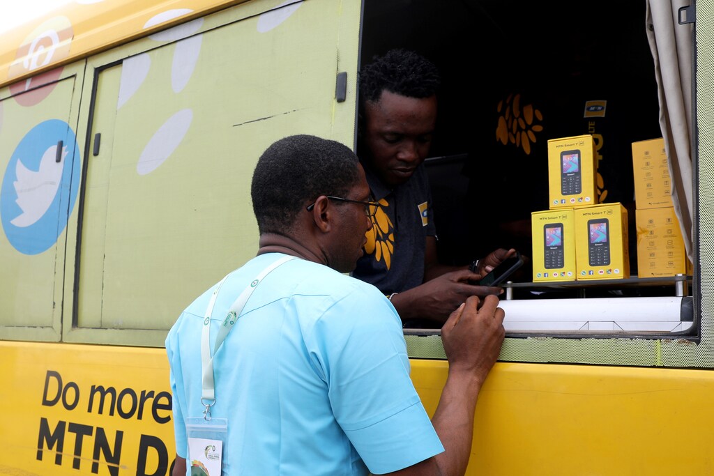 An MTN customer care staff attends to a client in an MTN service bus in Lagos, Nigeria August 28, 2019. Picture taken August 28, 2019. REUTERS/Temilade Adelaja - RC1AB3354300