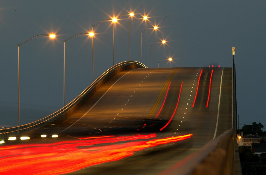 Taillights from vehicles are shown in a time exposure as motorists depart Atlantic Beach, North Carolina, which is located on a barrier island, September 16, 2003.
