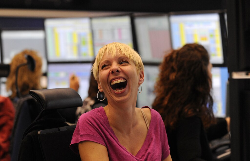 A share trader reacts as she sits behind her trading terminal at the Frankfurt stock exchange, October 13, 2008. REUTERS/Kai Pfaffenbach(GERMANY) - RTX9HX8